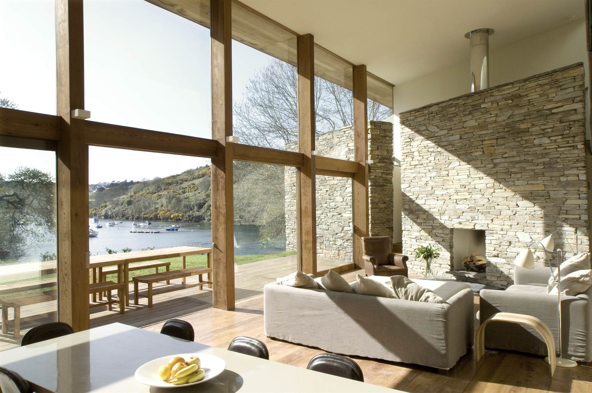 A contemporary lakeside house at dusk